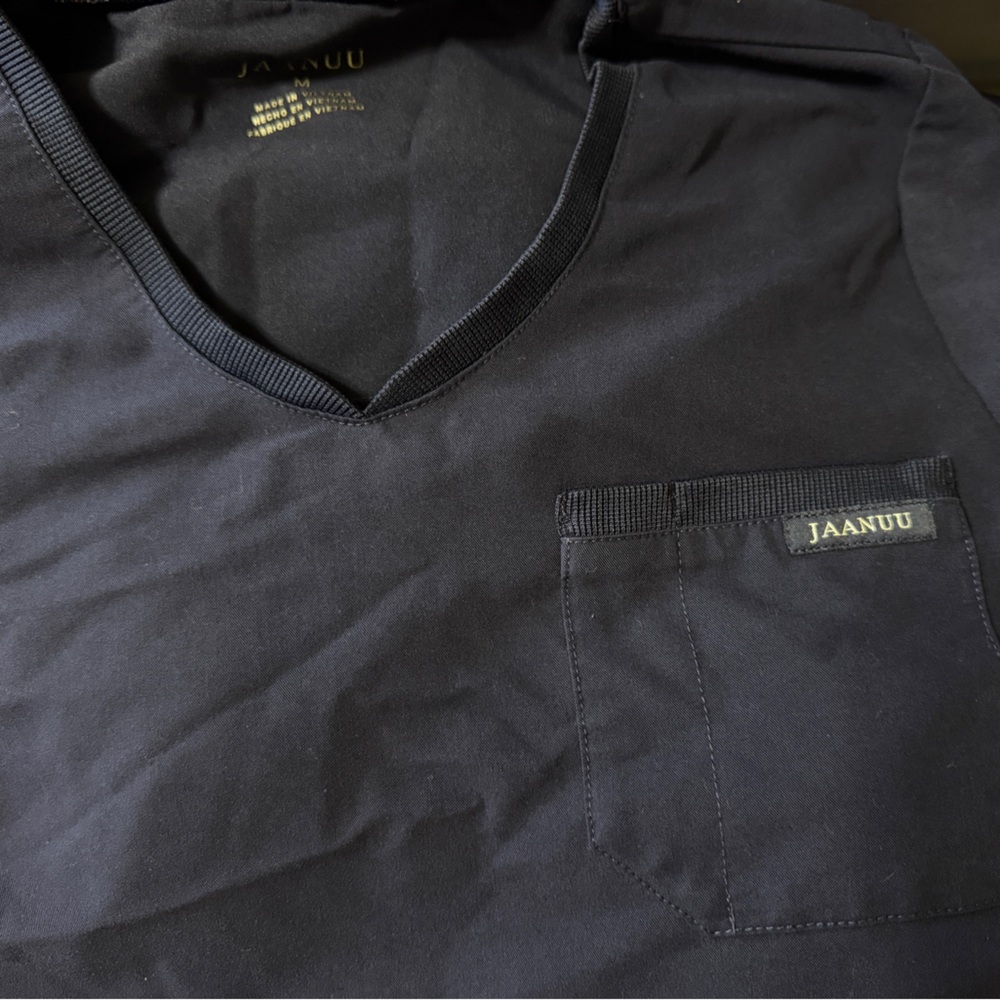 Jaanuu navy medium one pocket scrub top